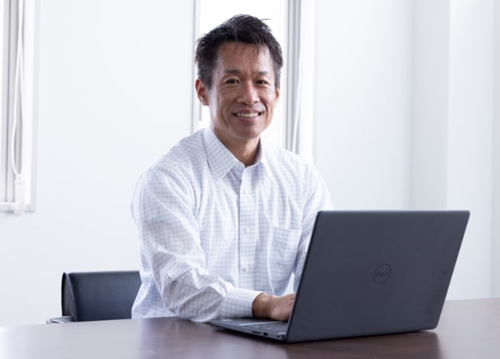 写真：常務取締役　榎　崇行